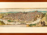 an old picture of a large city surrounded by mountains and trees