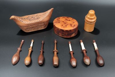 a lot of wooden spoons and a bowl on a table