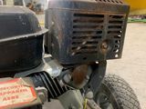 a close up of a lawn mower in a building