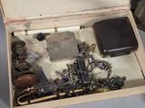 a box with a bunch of jewelry inside of it