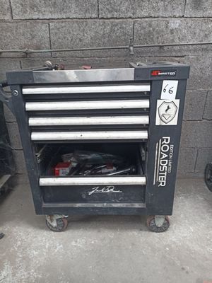 a tool cart with tools on it in a garage