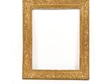 an old picture frame with a gold leaf pattern on a white background