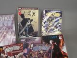 a lot of comic books sitting on a table