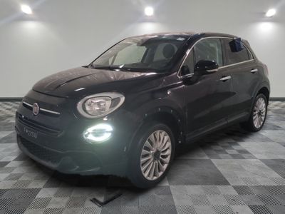 the small black car is parked in the garage on a checkered floor