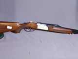 a rifle that is sitting on top of a table