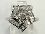 an image of a diamond ring with baguets on it