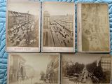 four old black and white photographs of a city street