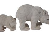 two statues of a bear and a bear cub on a white background