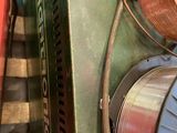 an image of a bunch of copper wires and a reel of wire