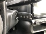 a close up of a remote control in a car
