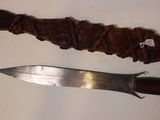 a knife and a knife holder on a table