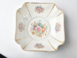 a white plate with a floral design on it