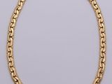 a gold chain necklace with a link