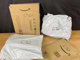 three bags of white plastic sitting on top of a wooden table