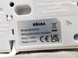 a close up of a white electronic device on a table