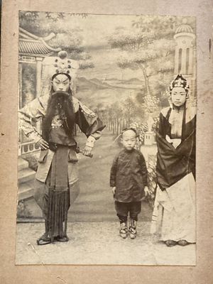 an old photo of a man and a woman with a child