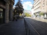 a train on the tracks going down the street