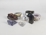 several different types of rocks and stones on a white surface