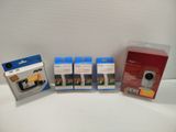 three packages of cameras are sitting next to each other on a table