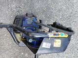 a blue machine that is sitting on the ground