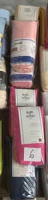 many different types of bedding on the shelves