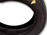 a close up of a tire on a white background