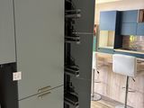 an image of a kitchen with a refrigerator and a counter