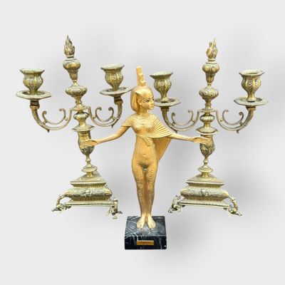 an image of a statue of a woman holding a candelabra