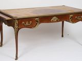 a small desk with two drawers on it