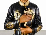 a statue of a man holding a cross in his hands
