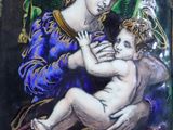 an image of a painting of a woman holding a baby in her arms
