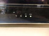 a close up of a remote control on a television