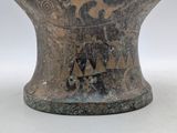 a vase that has a design on the side of it