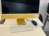 a computer on a desk with a keyboard and mouse