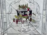 a white table cloth with a picture of a horse drawn carriage