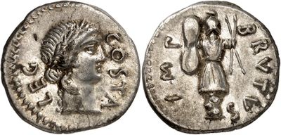 a silver coin with an image of a woman holding a staff