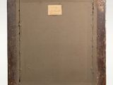 an old picture frame with a label on the bottom of it