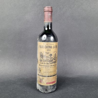 a close up of a bottle of wine on a table