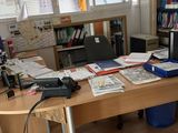 an image of a desk with a lot of books on it