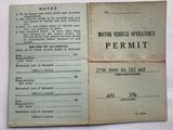 an old motor vehicle operator ' s permit on a table