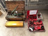 a box of tools sitting on the floor next to a box of tools