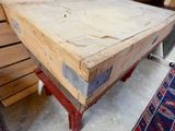 a wooden table that is sitting in a room