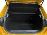 a trunk of a yellow car with its doors open