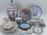 many different types of plates and bowls on the table