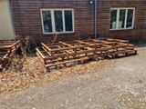 a wooden structure in front of a building that has been built