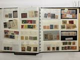an open book with a lot of stamps on it