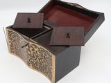 an image of a wooden box with a lid open on a white surface