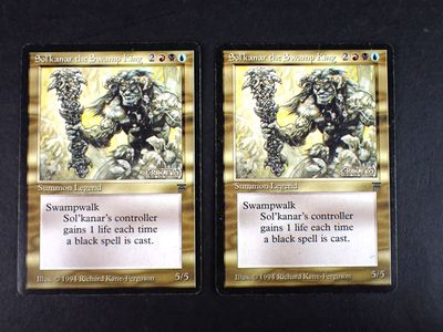 two cards of a card game with a picture of a gorilla and a gorilla