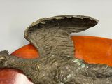 a statue of an eagle that is sitting on top of a table