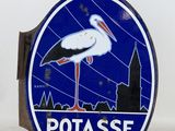 a blue and white sign with a stork on it